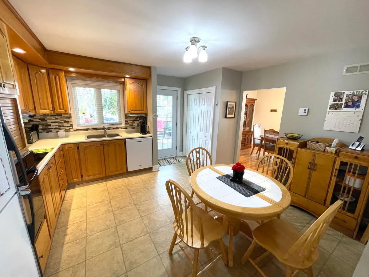 Eat-in kitchen with wooden cabinets and a breakfast table